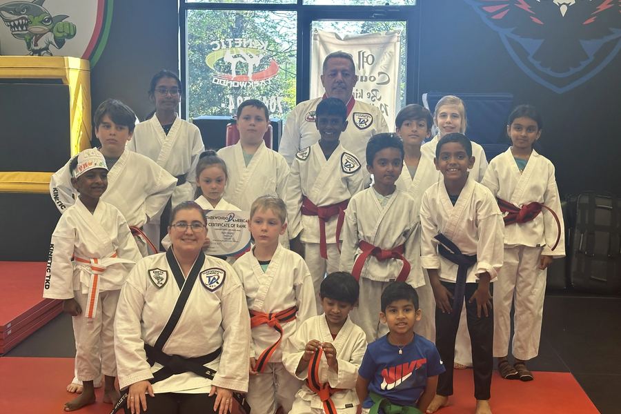 A Kinetic Taekwondo class group photo after a belt promotion